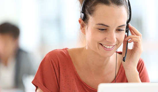 Image of a female helpdesk operator taking a call