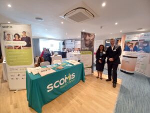 Raksha and Lewis with Scomis stand at DSLS conference